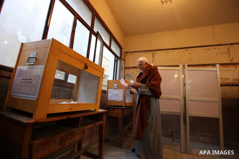 An elderly Egyptian man casts his vote at a polling station in the Manial neighbourhood of Cairo on November 28, 2011. Egyptians began voting in the first elections since the fall of autocrat Hosni Mubarak who was ousted...