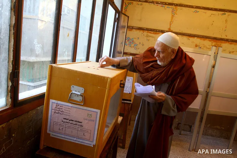 An elderly Egyptian man casts his vote at a polling station in the Manial neighbourhood of Cairo on November 28, 2011. Egyptians began voting in the first elections since the fall of autocrat Hosni Mubarak who was ousted...