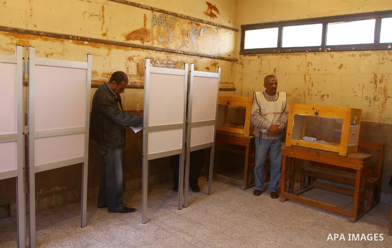 An elderly Egyptian man casts his vote at a polling station in the Manial neighbourhood of Cairo on November 28, 2011. Egyptians began voting in the first elections since the fall of autocrat Hosni Mubarak who was ousted...