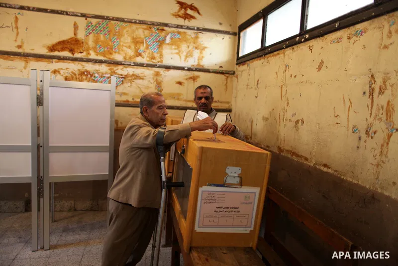 An elderly Egyptian man casts his vote at a polling station in the Manial neighbourhood of Cairo on November 28, 2011. Egyptians began voting in the first elections since the fall of autocrat Hosni Mubarak who was ousted...