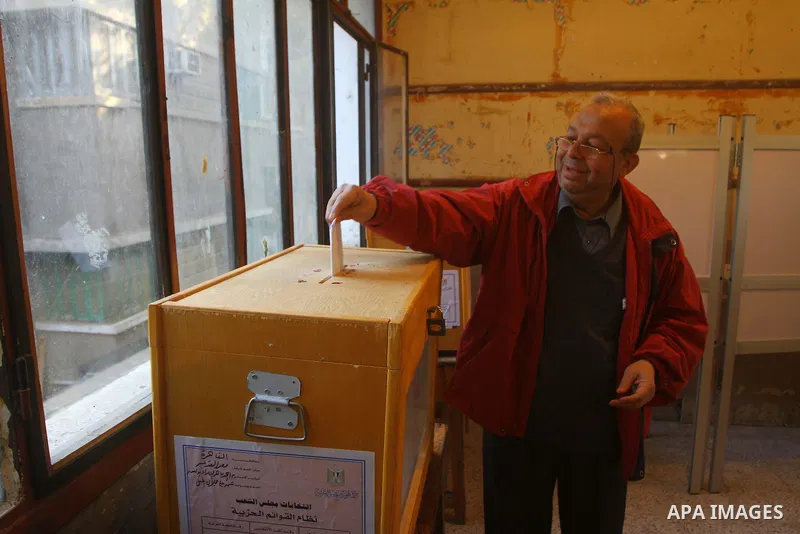 A Egyptian man casts his vote at a polling station in the Manial neighbourhood of Cairo on November 28, 2011. Egyptians began voting in the first elections since the fall of autocrat Hosni Mubarak who was ousted in Febru...