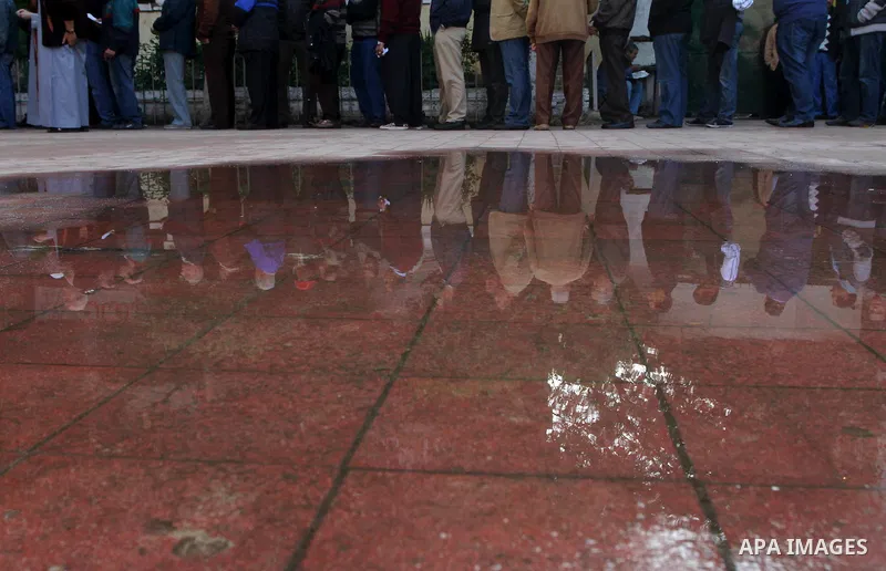 Egyptian voters queue at a polling station in the Manial neighbourhood of Cairo on November 28, 2011. Egyptians began voting in the first elections since the fall of autocrat Hosni Mubarak who was ousted in February in o...