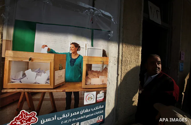 A Egyptian woman casts his vote at a polling station in the Manial neighbourhood of Cairo on November 28, 2011. Egyptians began voting in the first elections since the fall of autocrat Hosni Mubarak who was ousted in Feb...