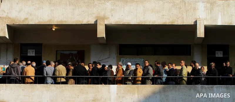 Egyptian voters queue at a polling station in the Manial neighbourhood of Cairo on November 28, 2011. Egyptians began voting in the first elections since the fall of autocrat Hosni Mubarak who was ousted in February in o...