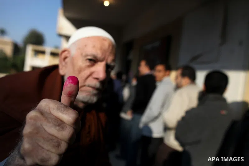 An elderly Egyptian man casts his vote at a polling station in the Manial neighbourhood of Cairo on November 28, 2011. Egyptians began voting in the first elections since the fall of autocrat Hosni Mubarak who was ousted...