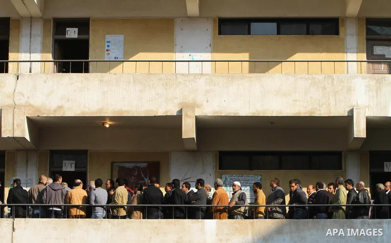 Egyptian voters queue at a polling station in the Manial neighbourhood of Cairo on November 28, 2011. Egyptians began voting in the first elections since the fall of autocrat Hosni Mubarak who was ousted in February in o...