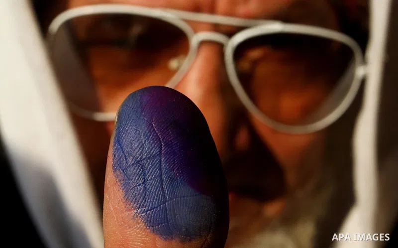 An Egyptian man shows his ink-stained thumb after casting his vote at a polling station in the Manial neighbourhood of Cairo on November 28, 2011. Egyptians began voting in the first elections since the fall of autocrat...