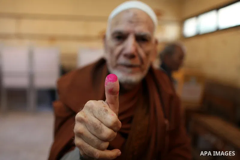 An elderly Egyptian man casts his vote at a polling station in the Manial neighbourhood of Cairo on November 28, 2011. Egyptians began voting in the first elections since the fall of autocrat Hosni Mubarak who was ousted...