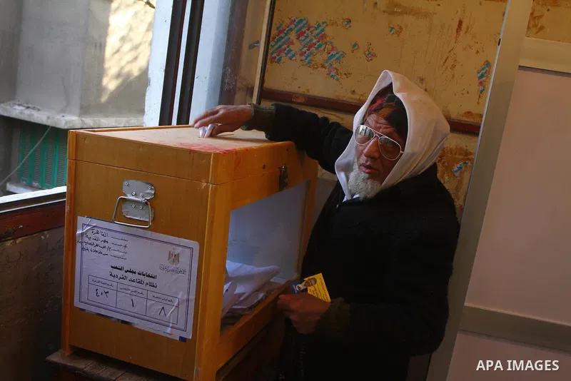 Egyptian woman marks her finger with ink after casting her vote during the first round of Egypt's Parliamentary elections at Kasr al-Aini polling station, in Cairo, Egypt, 28 November 2011. According to media reports, Po...