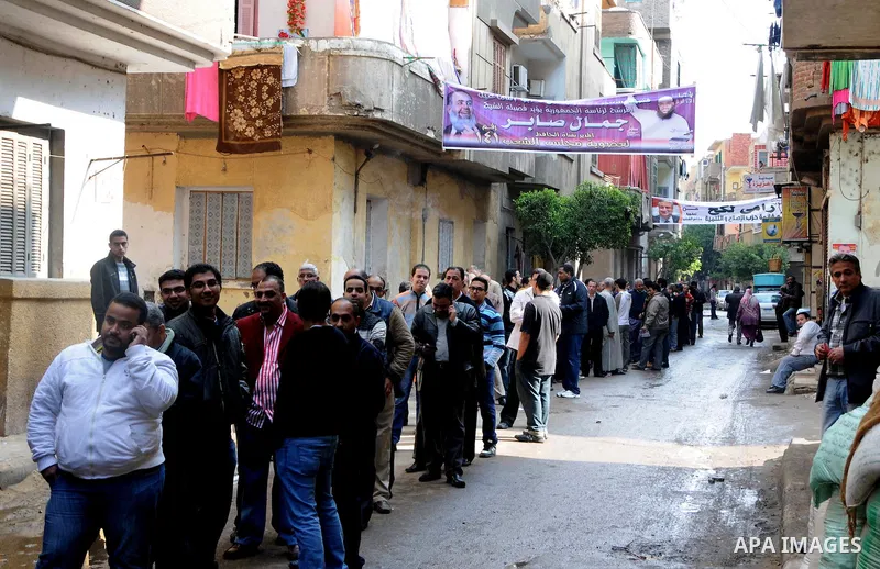 Egyptian voters queue at a polling station in the Manial neighbourhood of Cairo on November 28, 2011. Egyptians began voting in the first elections since the fall of autocrat Hosni Mubarak who was ousted in February in o...