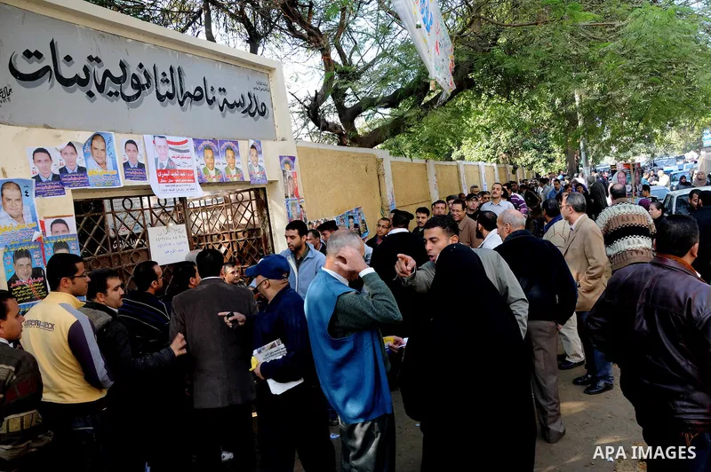 Egyptian voters queue at a polling station in the Manial neighbourhood of Cairo on November 28, 2011. Egyptians began voting in the first elections since the fall of autocrat Hosni Mubarak who was ousted in February in o...