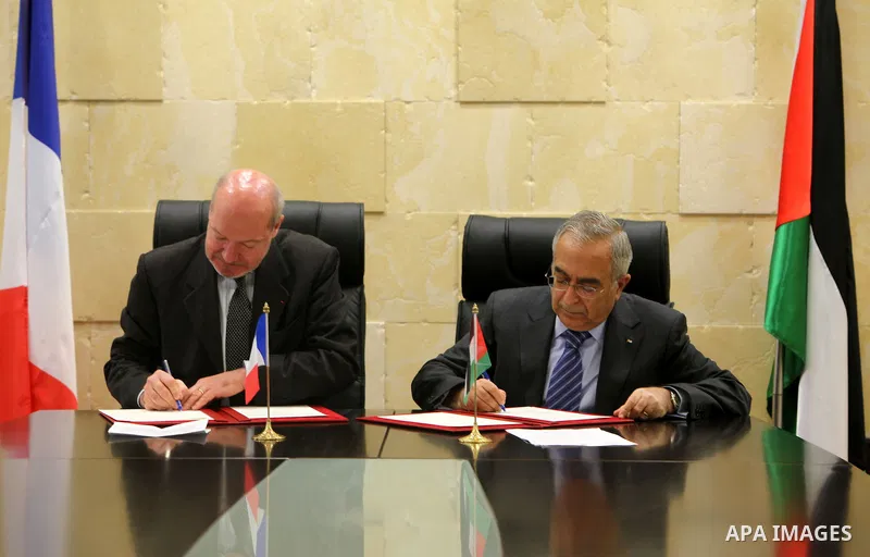 Palestinian Prime Minister, Salam Fayyad attends the signing of grant agreement with the French government in the West Bank city of Ramallah on Nov. 28,2011. Photo by Mustafa Abu Dayeh