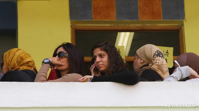 Egyptians wait in lines to vote during the first round of Egypt's Parliamentary elections at a polling station in Cairo on November 28, 2011. Egyptians began voting in the first elections since the fall of autocrat Hosni...
