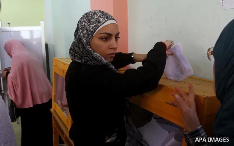 A Egyptian woman casts his vote at a polling station in Cairo on November 28, 2011. Egyptians began voting in the first elections since the fall of autocrat Hosni Mubarak who was ousted in February in one of the most imp...