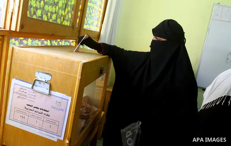 A Egyptian woman casts his vote at a polling station in Cairo on November 28, 2011. Egyptians began voting in the first elections since the fall of autocrat Hosni Mubarak who was ousted in February in one of the most imp...