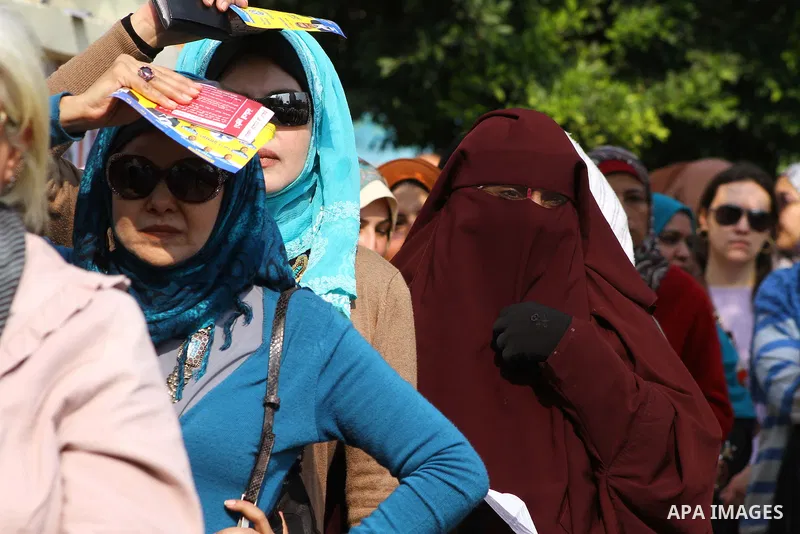 Egyptians wait in lines to vote during the first round of Egypt's Parliamentary elections at a polling station in Cairo on November 28, 2011. Egyptians began voting in the first elections since the fall of autocrat Hosni...