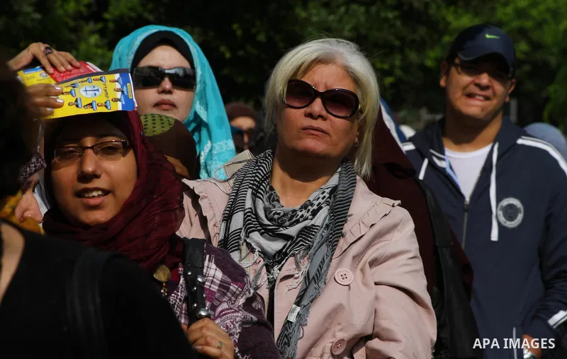 Egyptians wait in lines to vote during the first round of Egypt's Parliamentary elections at a polling station in Cairo on November 28, 2011. Egyptians began voting in the first elections since the fall of autocrat Hosni...