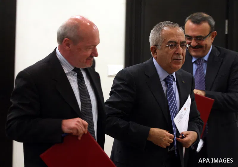 Palestinian Prime Minister, Salam Fayyad and French Consul-General, Frederick Dzanao attend the signing of grant agreement from the French government with 10 million euros in support of the budget of the National Authori...