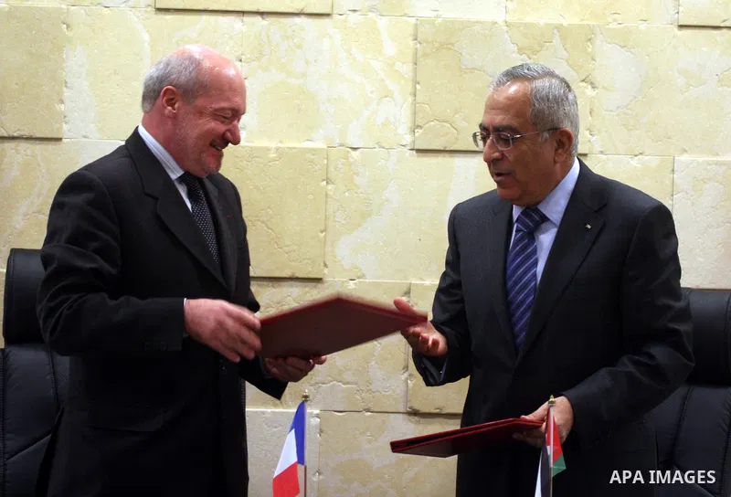 Palestinian Prime Minister, Salam Fayyad and French Consul-General, Frederick Dzanao attend the signing of grant agreement from the French government with 10 million euros in support of the budget of the National Authori...