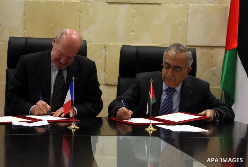 Palestinian Prime Minister, Salam Fayyad and French Consul-General, Frederick Dzanao attend the signing of grant agreement from the French government with 10 million euros in support of the budget of the National Authori...