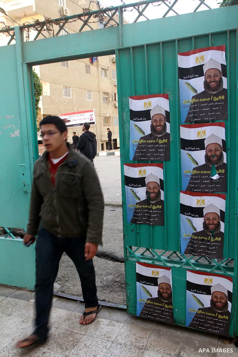 A Egyptian man casts his vote at a polling station in the Manial neighbourhood of Cairo on November 28, 2011. Egyptians began voting in the first elections since the fall of autocrat Hosni Mubarak who was ousted in Febru...