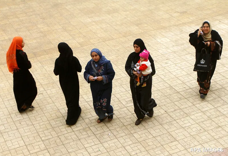 Egyptians cast their ballot at a parliamentary polling station in Cairo on November 29, 2011. Egypt hailed the start of its first post-revolution election as a triumph for democracy as more voters headed to the polls, bo...