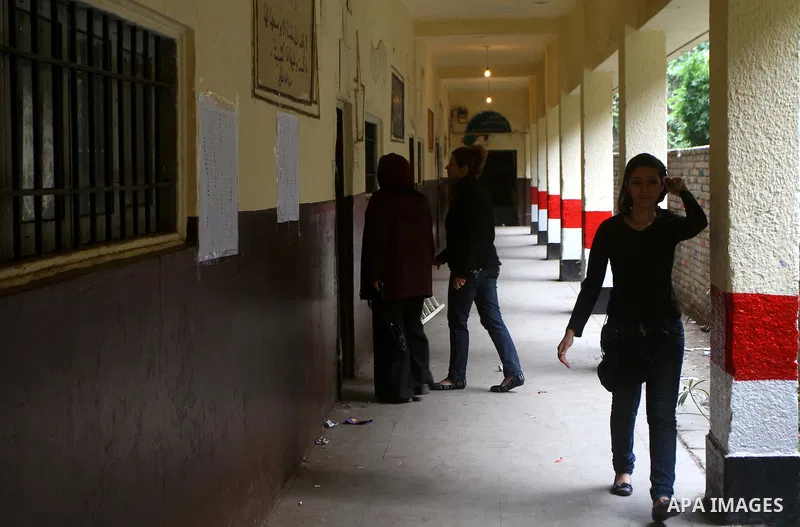 Egyptians cast their ballot at a parliamentary polling station in Cairo on November 29, 2011. Egypt hailed the start of its first post-revolution election as a triumph for democracy as more voters headed to the polls, bo...