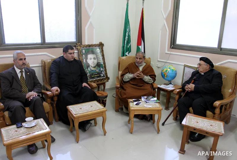 A Palestinian Hamas leader, Mahmoud al-Zahar meets with Manuel Musalam, the member of Consortium of Independent Palestinians (CIP), in Gaza city on Nov. 29,2011. Photo by Mohammed Asad