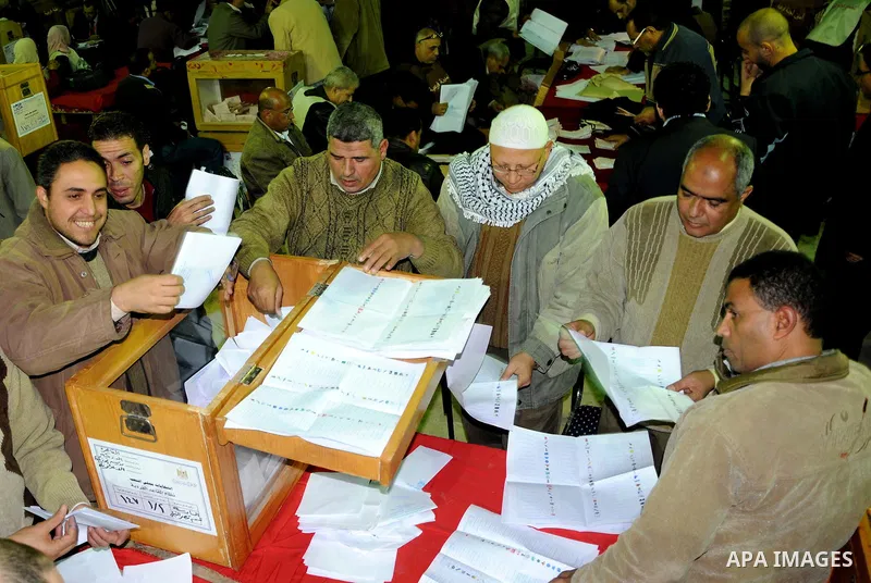 Election workers count ballots for the parliamentary elections in Luxor, Egypt, Tuesday, Nov. 29, 2011. Egypt's military rulers are taking credit for the strong turnout in the country's first parliamentary elections sinc...