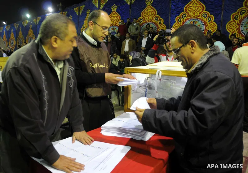 Election workers count ballots for the parliamentary elections in Luxor, Egypt, Tuesday, Nov. 29, 2011. Egypt's military rulers are taking credit for the strong turnout in the country's first parliamentary elections sinc...