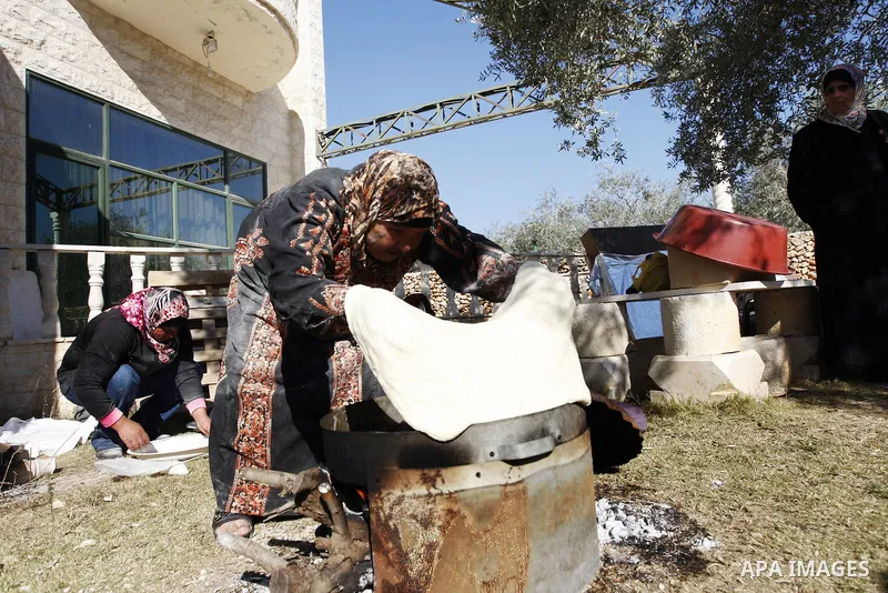 Palestinians participate in an exhibition for the Palestinian heritage, on November29, 2011 in the West Bank city of Nablus. Photo by Wagdi Eshtayah