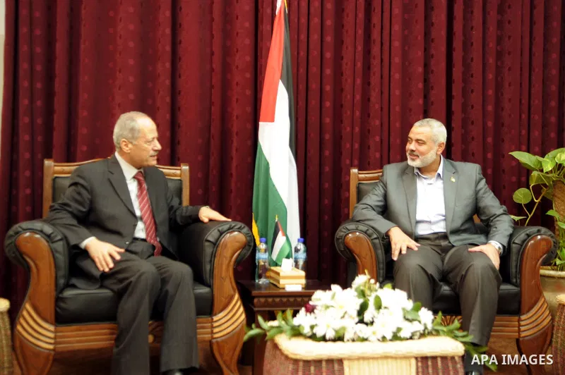 Palestinian prime minister in Gaza Strip, Ismail haniya attends a meeting with a delegation from the Democratic Front for Liberation Palestine at his office, in Gaza city on Nov. 30,2011. Photo by Ahmed Shaat