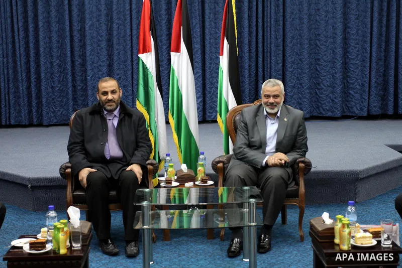 Palestinian prime minister in Gaza Strip, Ismail haniya attends a meeting with members of al-Shatea Services Sport Club at his office, in Gaza city on Nov. 30,2011. Photo by Mohammed Asad