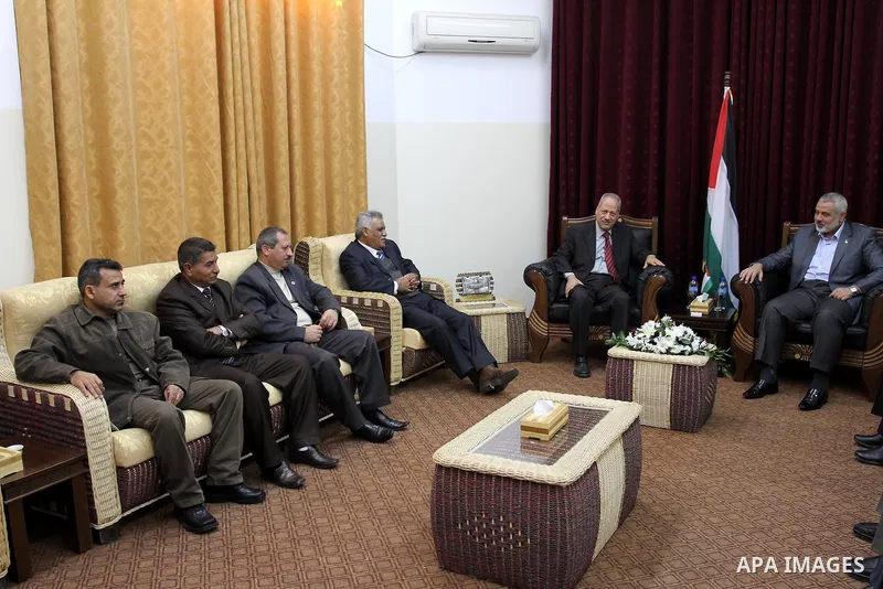 Palestinian prime minister in Gaza Strip, Ismail haniya attends a meeting with a delegation from the Democratic Front for Liberation Palestine at his office, in Gaza city on Nov. 30,2011. Photo by Mohammed Asad