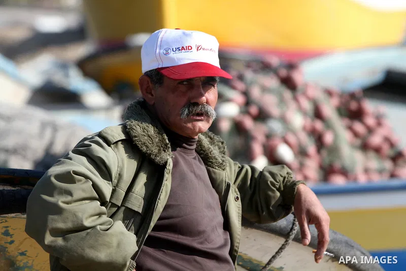 A Palestinian fisherman works at the port in Gaza City on December 01, 2011. Before the Israeli embargo on the Palestinian territory, some 3,500 fishermen plied their trade off Gaza's 40-kilometre (25-mile) Mediterranean...