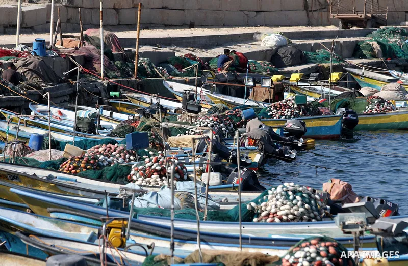 A Palestinian fisherman works at the port in Gaza City on December 01, 2011. Before the Israeli embargo on the Palestinian territory, some 3,500 fishermen plied their trade off Gaza's 40-kilometre (25-mile) Mediterranean...