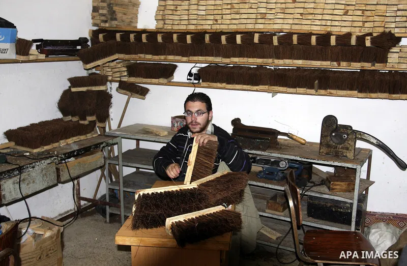 A Palestinian visually impaired, Mahmoud Said works in manufacturing brooms at his workshop in the Old City of Nablus, in the West Bank on Dec. 1,2011. Photo by Wagdi Eshtayah