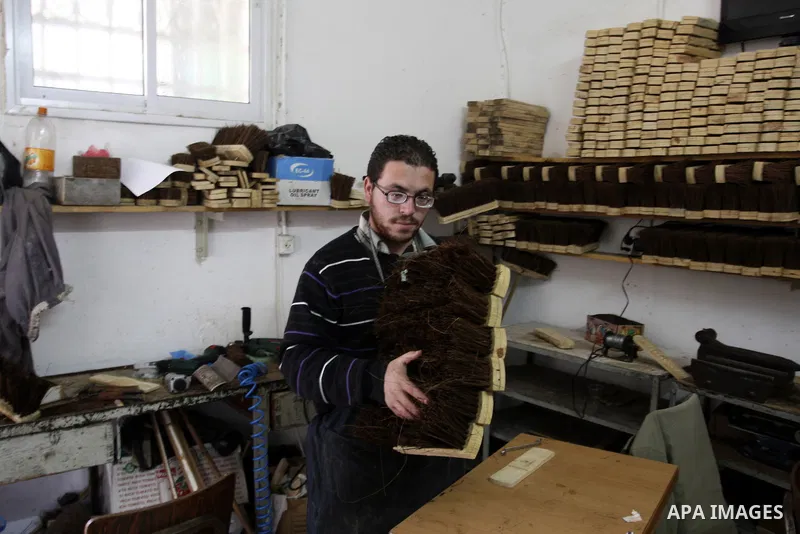 A Palestinian visually impaired, Mahmoud Said works in manufacturing brooms at his workshop in the Old City of Nablus, in the West Bank on Dec. 1,2011. Photo by Wagdi Eshtayah