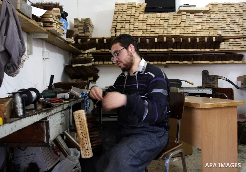 A Palestinian visually impaired, Mahmoud Said works in manufacturing brooms at his workshop in the Old City of Nablus, in the West Bank on Dec. 1,2011. Photo by Wagdi Eshtayah