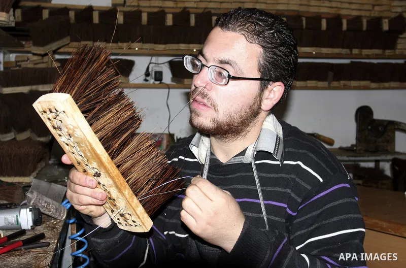 A Palestinian visually impaired, Mahmoud Said works in manufacturing brooms at his workshop in the Old City of Nablus, in the West Bank on Dec. 1,2011. Photo by Wagdi Eshtayah