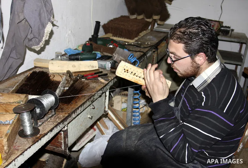 A Palestinian visually impaired, Mahmoud Said works in manufacturing brooms at his workshop in the Old City of Nablus, in the West Bank on Dec. 1,2011. Photo by Wagdi Eshtayah