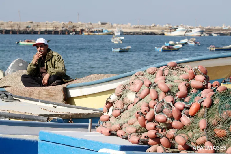 A Palestinian fisherman works at the port in Gaza City on December 01, 2011. Before the Israeli embargo on the Palestinian territory, some 3,500 fishermen plied their trade off Gaza's 40-kilometre (25-mile) Mediterranean...