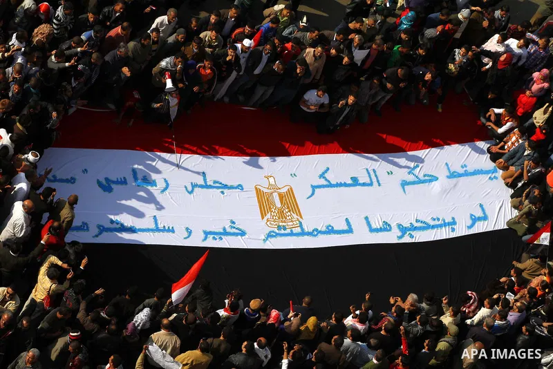 Egyptian protesters attend a demonstration in Tahrir Square, in Cairo, Egypt, Friday, Dec. 2, 2011. Islamists appear to have taken a strong majority of seats in the first round of Egypt's first parliamentary vote since H...