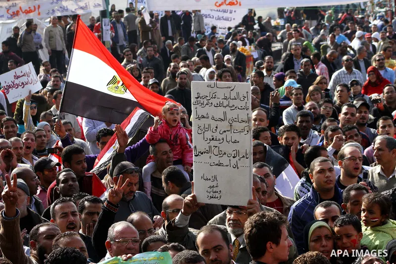 Egyptian protesters attend a demonstration in Tahrir Square, in Cairo, Egypt, Friday, Dec. 2, 2011. Islamists appear to have taken a strong majority of seats in the first round of Egypt's first parliamentary vote since H...