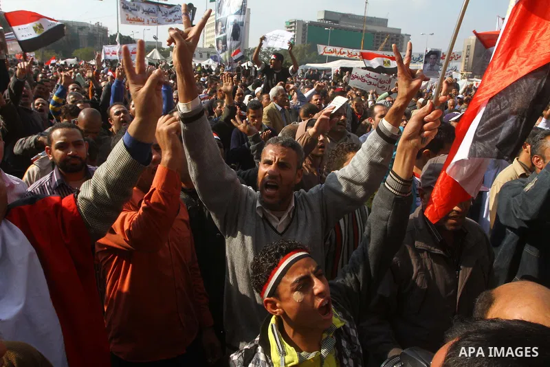 Egyptian protesters attend a demonstration in Tahrir Square, in Cairo, Egypt, Friday, Dec. 2, 2011. Islamists appear to have taken a strong majority of seats in the first round of Egypt's first parliamentary vote since H...
