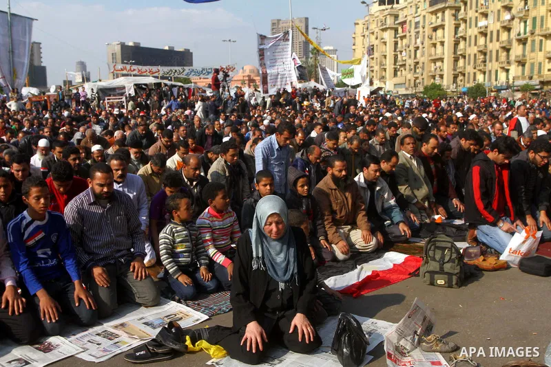 Egyptian protesters attend Friday prayers during a demonstration in Tahrir Square, in Cairo, Egypt, Friday, Dec. 2, 2011. Islamists appear to have taken a strong majority of seats in the first round of Egypt's first parl...