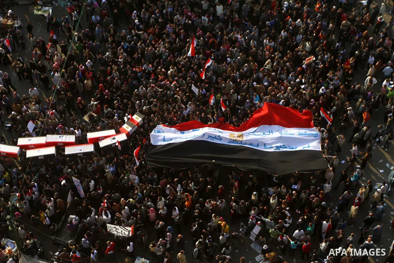 Egyptian protesters carry symbolic coffins honoring those killed in recent clashes with security forces during a rally in Tahrir Square, in Cairo, Egypt, Friday, Dec. 2, 2011. Islamists appear to have taken a strong majo...