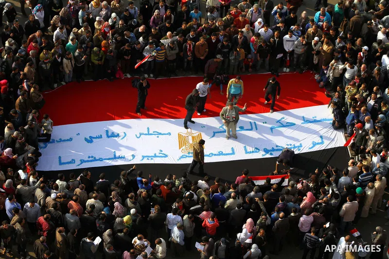 Egyptian protesters carry symbolic coffins honoring those killed in recent clashes with security forces during a rally in Tahrir Square, in Cairo, Egypt, Friday, Dec. 2, 2011. Islamists appear to have taken a strong majo...