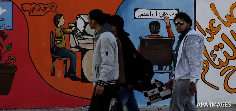 Palestinian Artists take part in paint a murals to mark the International Day for Persons with Disabilities on Dec. 03, 2011 in Gaza City.Photo by Mahmud Nassar