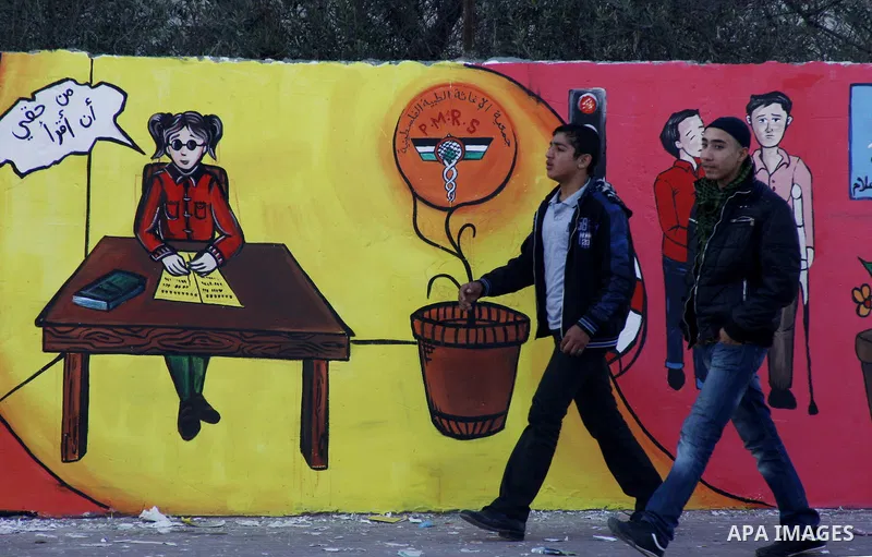 Palestinian Artists take part in paint a murals to mark the International Day for Persons with Disabilities on Dec. 03, 2011 in Gaza City.Photo by Mahmud Nassar